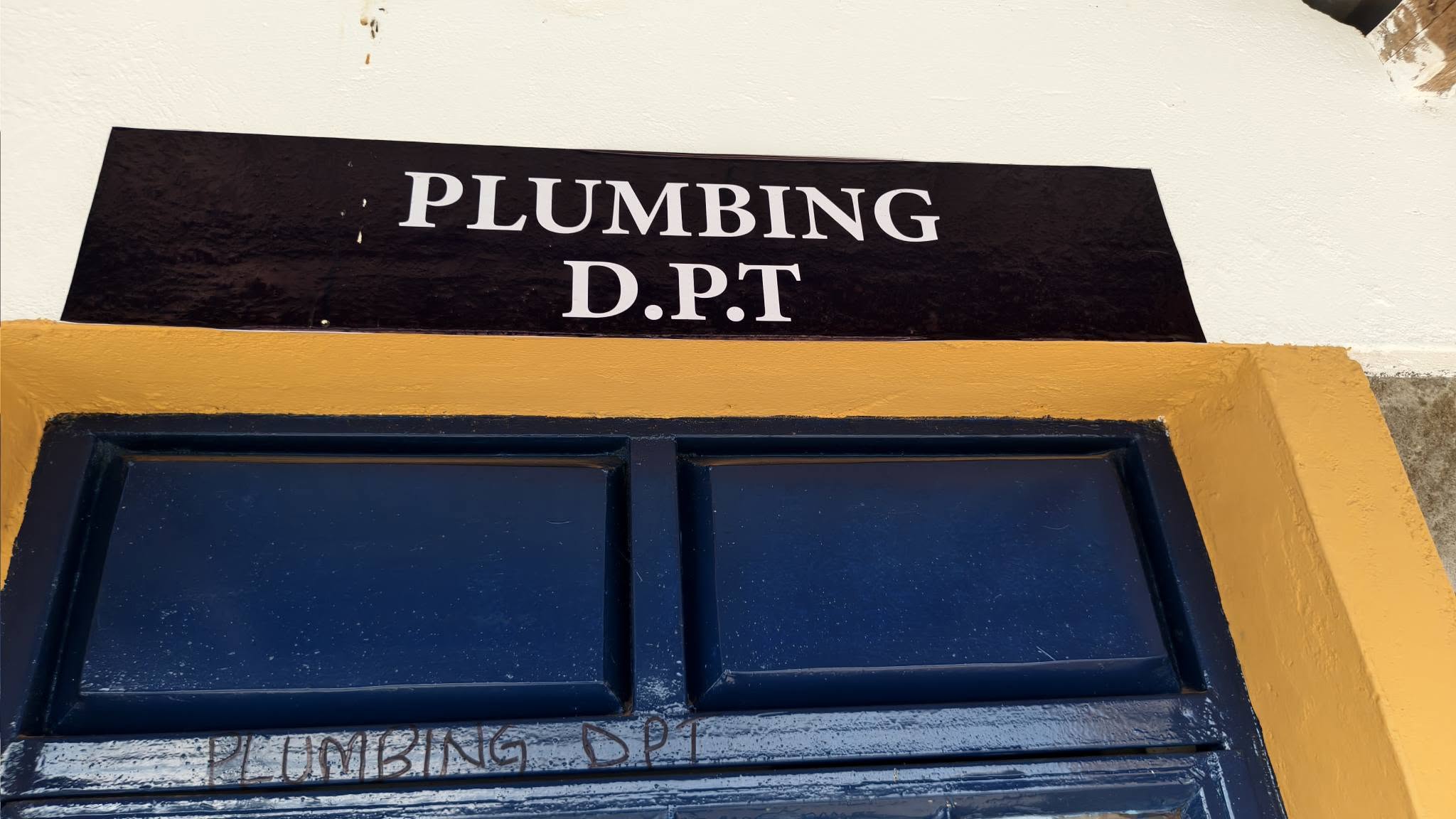 School of Plumbing department sign